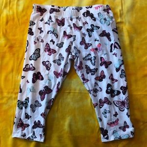 white leggings with a butterflies pattern